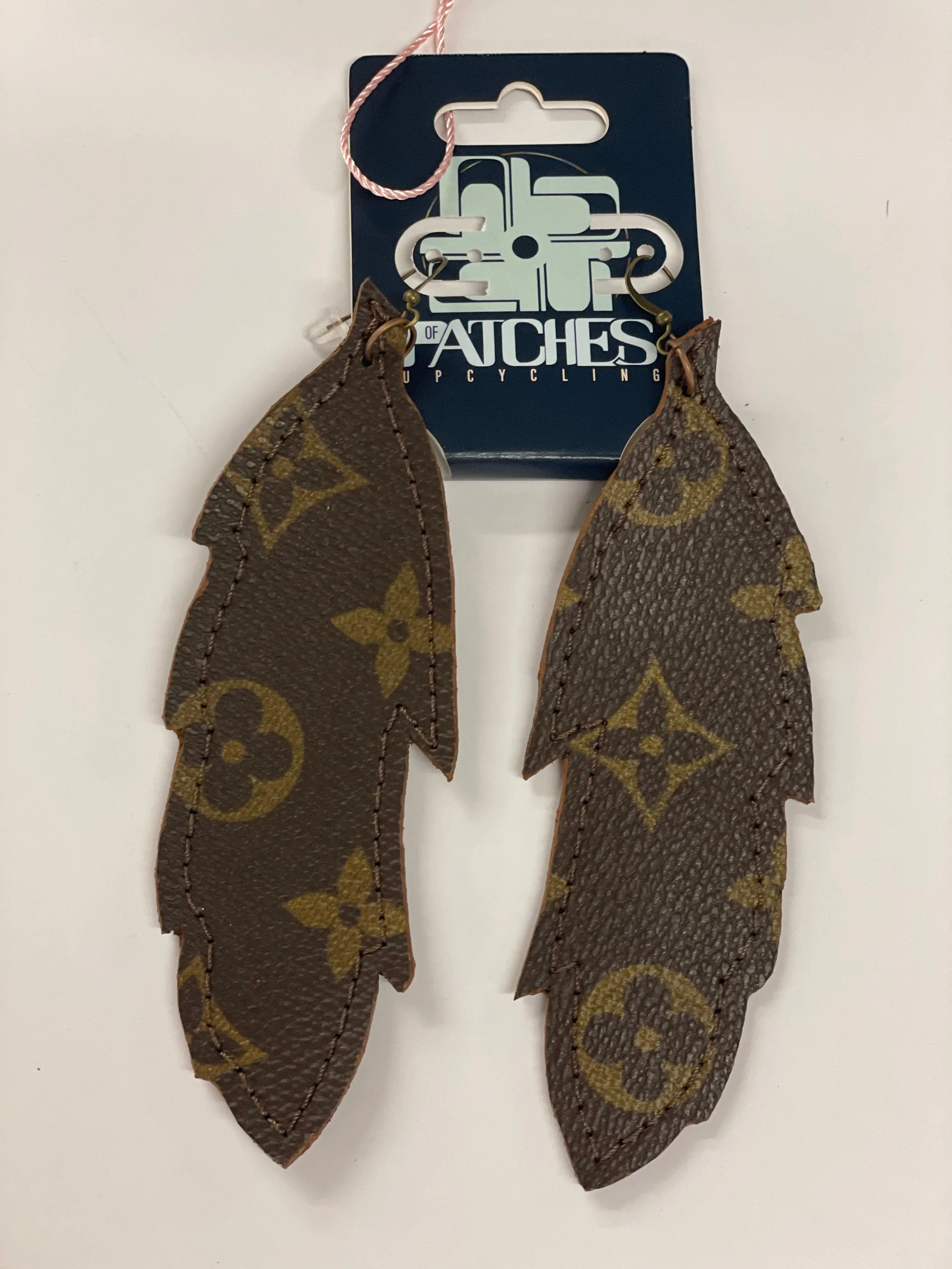 Large feather flourish earrings
